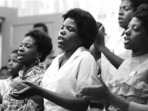 Young-women-sing-freedom-songs-Selma-church-070864-by-©-Matt-Herron-Take-Stock-Photos-web-300x226, Ten things you should know about Selma before you see the film, Culture Currents 