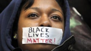 Black-Lives-Matter-taped-over-young-Black-womans-mouth-300x169, The value of Black life in America, Part 1, Abolition Now! 