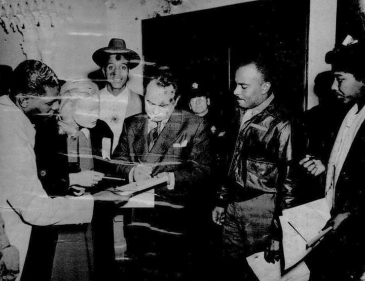 Edward-G.-Robinson-signs-autographs-at-Leola-Kings-Blue-Mirror-on-Fillmore, Legendary ‘Queen of Fillmore’ Leola King leaves proud legacy of struggle against Redevelopment, Culture Currents 