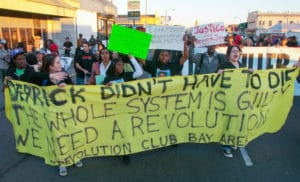 Derrick-Jones-rally-marchers-with-banner-111110-by-Felix-Barrett-web-300x182, 22 months after Oscar Grant: OPD ‘justifiably’ murder unarmed Black barbershop owner in East Oakland, Local News & Views 