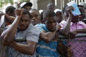Haitians-line-up-to-legalize-status-before-midnight-deadline-Santo-Domingo-DR-061715-3-by-Erika-Santelices-AFP-web-300x200, The tragic, bloody origins of the Dominican Republic’s plan to erase much of its Black population, World News & Views 