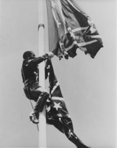 Spartacist-League-supporter-Richard-Bradley-in-Union-soldier’s-uniform-cuts-down-Confederate-battle-flag-SF-Civic-Center-041584-by-Workers-Vanguard-web-237x300, 1984: Confederate flag of slavery taken down from San Francisco Civic Center – 3 times!, Local News & Views 