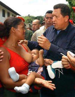 Hugo-Chavez-speaks-with-young-mother-nursing-baby, Former U.S. Congresswoman Cynthia McKinney completes PhD at Antioch University, despite having to scrub WikiLeaks from her dissertation, Culture Currents 