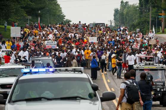 Mike-Brown-murder-anniversary-crowd-marches-Ferguson-080915, State of emergency declared in Ferguson as cops shoot Mike Brown’s friend on anniversary of the murder that sparked the movement, News & Views 