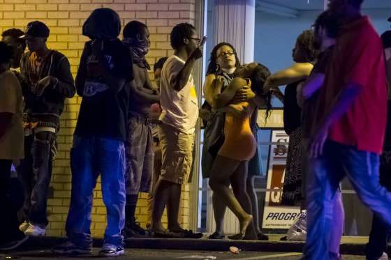 Mike-Brown-murder-anniversary-woman-collapses-after-Tyrone-Harris-Jr.-shot-Ferguson-080915, State of emergency declared in Ferguson as cops shoot Mike Brown’s friend on anniversary of the murder that sparked the movement, News & Views 