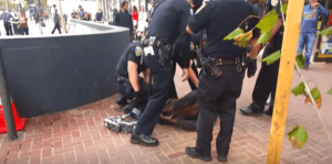 SFPD-beats-Black-one-legged-homeless-man-42-at-8th-Market-080415-by-Chaedria-LaBouvier-300x149, I watched 14 police officers take down a one-legged homeless Black man outside Twitter HQ – and nobody could stop them, Local News & Views 
