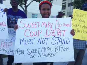 Protesters-outside-Haitian-presidential-debate-denounce-Aug.-9-election-Miami-100415-by-Haiti-Information-Project-300x225, Election 2015: The fight for voting rights and sovereignty in Haiti, World News & Views 
