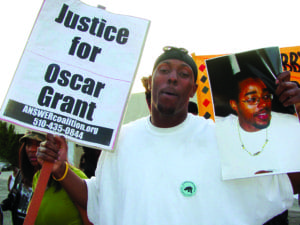 Lovelle-Mixon-march-Oscar-Grant-032509-by-Dave-Id-Indybay-orig-300x225, Remembering Oakland rebel Lovelle Mixon, Local News & Views 