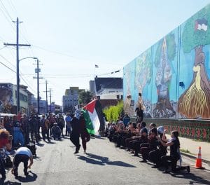 George-Jackson-in-the-Sun-of-Palestine-Silk-Road-Debke-Troupe-dance-Oakland-Palestine-Solidarity-Mural-Oakland-051516-by-Greg-Thomas-web-300x264, Black Panthers and Diaspora Palestinians illuminate shared struggle on Nakba day, Culture Currents 