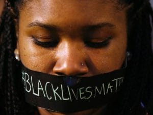 Black-young-woman-tape-over-mouth-BlackLivesMatter-by-Reuters-300x225, SNCC Legacy Project endorses the Movement for Black Lives Policy Platform, News & Views 