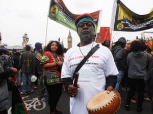 London-Reparations-March-Baba-Jahahara-on-Westminster-Bridge-3-min.-silence-for-ancestors-080116-by-Jahahara-web-300x225, Reparationists take the power, and da funk, to Parliament in London!, World News & Views 