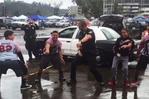 San-Diego-cop-dances-with-kids-to-help-community-relations-0816-300x200, Police run feel-good PR campaign while criminalizing Black August, Local News & Views 