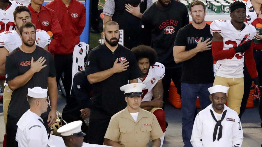 Colin-Kaepernick-kneels-next-to-former-Green-Beret-Nate-Boyer-natl-anthem-San-Diago-Chargers-game-090116-by-Chris-Carlson-AP, Dear readers, let’s reach out to Colin Kaepernick about supporting the SF Bay View newspaper, Local News & Views 