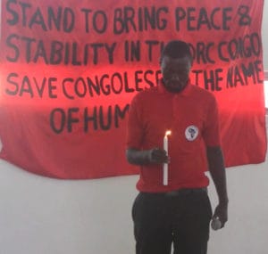 Congolese-Solidarity-Campaign-Stand-to-bring-peace-stability-in-the-DRC-Congo-man-w-candle-300x285, South Africans, Congolese to picket Kabila at DRC Embassy in Pretoria, World News & Views 