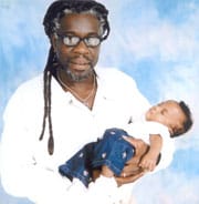 Mutulu-with-grandchild, President Obama: Support Dr. Mutulu Shakur’s clemency petition, Behind Enemy Lines 