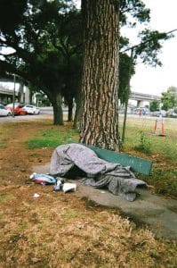 Oakland-unhoused-person-makes-home-of-bench-blanket-by-Pedro-Del-Norte-199x300, Oakland attacks the poor on behalf of the affluent, Local News & Views 