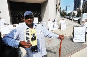 Booker-T.-Washington-Insurance-Co.-bldg-Michael-D.-Williams-protests-removal-of-A.G.-Gaston-sidewalk-star-092013-2-by-Frank-Couch-Birmingham-News-300x199, Alabama’s Holman Prison bans the Bay View for being ‘racially motivated,’ subscriber declares hunger strike, Behind Enemy Lines 
