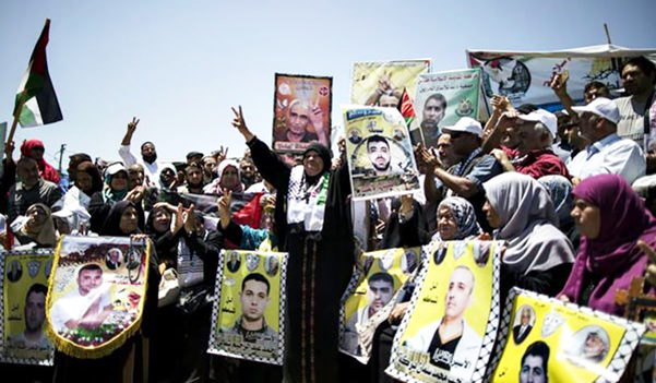 Palestinians-celebrate-0522517-end-of-political-prisoners-hunger-strike, Palestinian prisoners support network stands in solidarity with U.S. prisoners on hunger strike in Folsom State Prison, while celebrating Palestinian hunger strikers’ victory, Behind Enemy Lines 