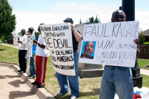 Anti-Kagame-protest-at-Oklahoma-Christian-University-signs-re-Congo-war-crimes-043010-by-Kendall-Brown-300x199, Killing the Congolese people, an interview with Sylvestre Mido, World News & Views 