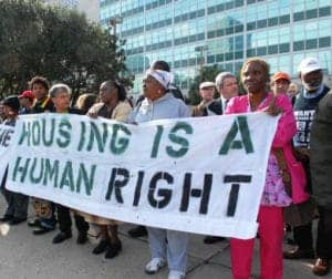 Housing-is-a-human-right-banner-held-by-Black-women-300x252, Housing is a human right, Local News & Views 