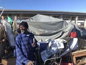 Lee-manages-section-of-large-homeless-encampment-north-end-of-Wood-St-West-Oakland-011018-by-Walter-Thompson-Hoodline-300x225, West Oakland’s class warfare, Local News & Views 