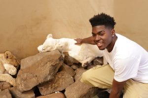 Mack-to-Africa-Oakland-student-pets-lion-cubs-web-300x200, Oakland students embark on study abroad in South Africa, Culture Currents 