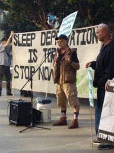 Rally-to-end-sleep-deprivation-Bato-speaks-outside-SF-Federal-Courthouse-020818-by-Mark-Fujiwara-225x300, Rally, press conference and court solidarity to end sleep deprivation, Behind Enemy Lines 