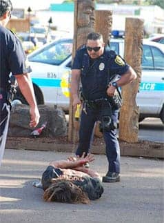 Taser-wielding-white-cop-stands-over-Black-victim, John Crew: Don’t be fooled by the POA, No on H, more aggressive use of Tasers, Local News & Views 