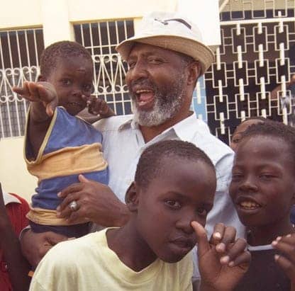 fr-gerard-jean-juste-laughing-with-children, Revolutionary Haitian priest Gerard Jean-Juste, presente!, World News & Views 