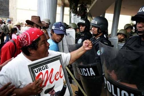 Black-Honduran-woman-shakes-fist-at-police-071509, The implications of the coup in Honduras on Afro-descendants, World News & Views 
