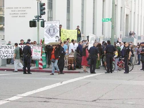 Mehserle-prelim-hrg-protesters-on-Courthouse-corner-051809-by-Dave-Id-Indybay, Watching the murder trial of Mehserle: an interview with Cop Watch Oakland cofounder Rekia Mohammed Jabrin, Local News & Views 