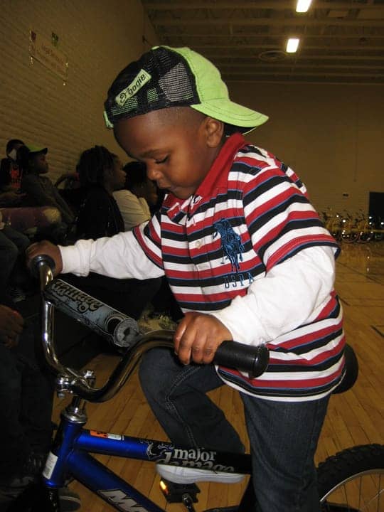 All-of-Us-or-None-13th-Annual-Community-Giveback-Jerimiah-Turner-4-rides-1st-bike-120812, Children receive gifts from loved ones behind bars at Community Giveback, Local News & Views 