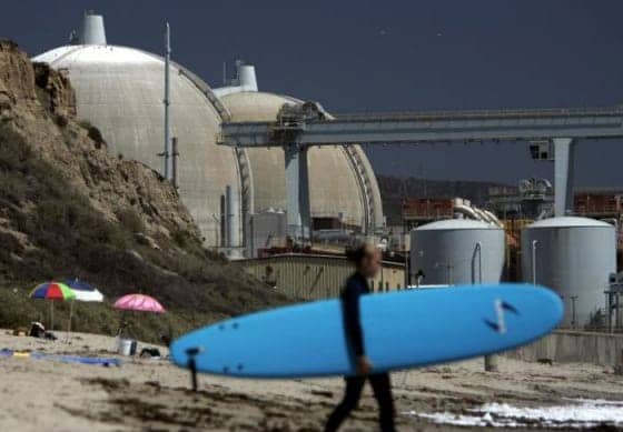 Surfer-at-San-Onofre-State-Beach-in-shadow-of-San-Onofre-Nuclear-Generating-Station-by-Orange-County-Register, Showdown at San Onofre, News & Views 