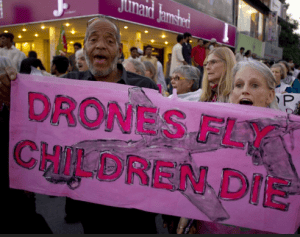 Drones-fly-children-die-protest-march-banner-Black-man, Have we sold our souls by turning a blind eye to Obama’s drones?, News & Views 