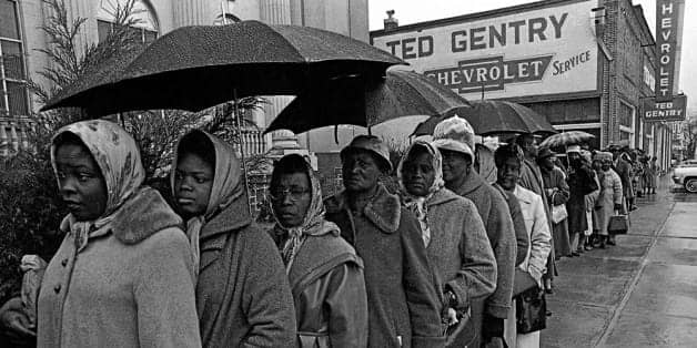 Blacks-line-up-in-rain-to-register-to-vote-1965-Alabama-by-AP, Supreme Court hears Voting Rights Act challenge: The legal fight to protect white power, News & Views 