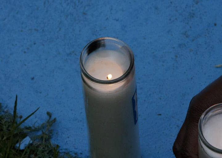 Alan-Blueford-1st-year-memorial-lit-candle-at-nightfall-050513-by-Malaika, Killer cop vengeance: Was the OPD killing of Alan Blueford a retaliatory hit?, Local News & Views 