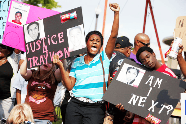 Trayvon-Martin-demonstration-by-Julie-Fletcher-AP, Trayvon Martin killer George Zimmerman’s attorneys fabricate evidence, News & Views 