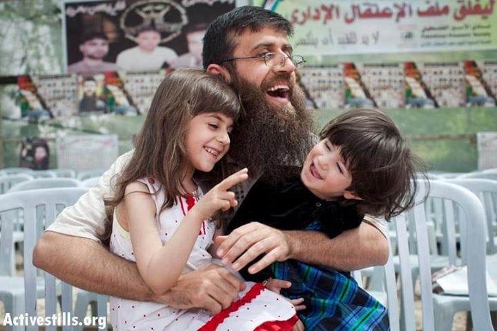 Khader-Adnan-reunited-with-his-children-0212, Palestinian survivor of 66-day hunger strike pledges solidarity with striking American prisoners, Abolition Now! 