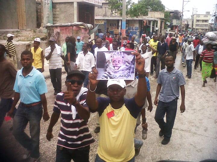 Anti-Martelly-pro-Aristide-march-Martelly-the-thieving-cat-on-21st-anniversary-of-1991-coup-against-Lavalas-093012-w, 10 steps to dictatorship: Why the grassroots movement in Haiti is taking to the streets against President Michel Martelly, World News & Views 