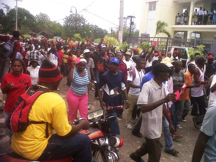 Anti-Martelly-pro-Aristide-march-red-cards-on-21st-anniversary-of-1991-coup-against-Lavalas-093012-web, 10 steps to dictatorship: Why the grassroots movement in Haiti is taking to the streets against President Michel Martelly, World News & Views 