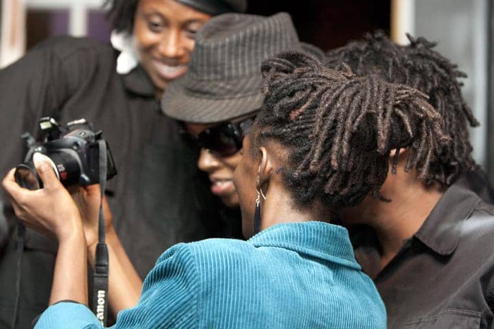 Black-Riders-doc-screening-checking-out-photos-at-One-Fam-Comy-Ctr-082413-web, To serve the people: Black Riders Liberation Party, new generation Black Panther Party for Self-Defense, Local News & Views 
