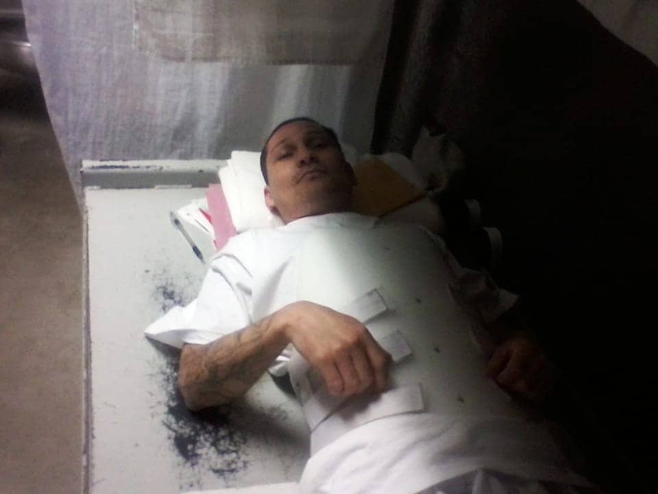 Juan-Jaimes-w-broken-back-in-brace-on-bare-bed-072312-pic-emailed-to-Kendra-web, Corcoran 2011 hunger strike petitioner needs legal help re retaliation, medical care, Abolition Now! 