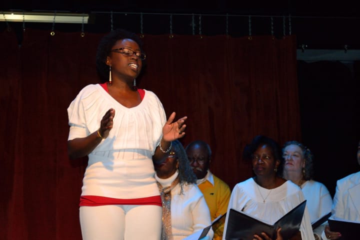 ‘Go-Tell-It’-Taiwo-sings-Negro-Spirituals-Heritage-Keepers-behind-her-1213-by-JR-web, Harriet Tubman Christmas play ‘Go Tell It’ is back: an interview wit’ playwright Taiwo Kujichagulia Seitu, Culture Currents 