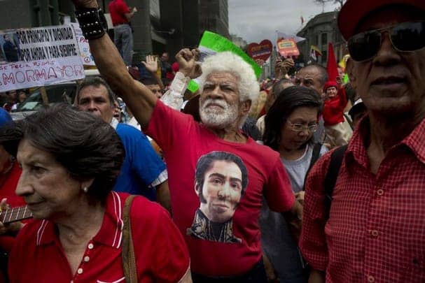 Venezuela-pro-gov-peace-march-by-elders-Simon-Bolivar-T-shirt-022314-by-Rodrigo-Abd-AP, What is happening in Venezuela?, World News & Views 