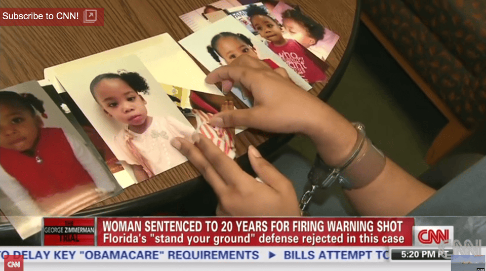 Marissa-Alexander-in-handcuffs-looks-at-pictures-of-her-children-by-CNN, Standing our ground: reproductive justice for Marissa Alexander, Abolition Now! 