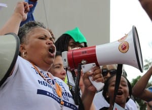 Detroit-Freedom-Friday-rally-Monica-Lewis-Patrick-of-We-the-People-protesting-water-shut-offs-071814-by-Rasheed-Shabazz-300x217, Hundreds of protestors flood Detroit streets to protest water shut-offs, News & Views 