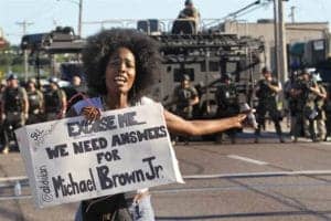 Michael-Brown-woman-protester-We-need-answers-backed-by-militarized-police-081314-by-J.B.-Forbes-St.-Louis-Post-Dispatch-AP-web-300x200, Israel-trained police ‘occupy’ Missouri after killing of Black youth, News & Views 