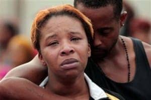 Michael-Browns-parents-Lesley-McSpadden-husband-Louis-Head-mourn-death-by-St.-Louis-suburb-Ferguson-PD-080914-by-Huy-Mach-St.-Louis-Post-Dispatch-AP-300x199, Police murder unarmed, fleeing Michael Brown, 18, in St. Louis suburb, News & Views 