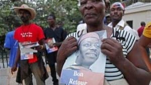 Aristide-supporters-Haiti-2013-by-Reuters-300x170, As former Haitian President Aristide is placed on house arrest, supporters worldwide demand immediate halt to attacks on him and Lavalas Movement, World News & Views 