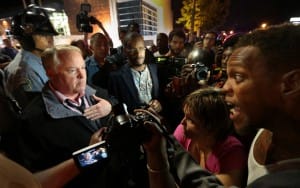 Michael-Brown-rebellion-Chief-Thomas-Jackson-speaks-with-protesters-before-riot-cops-attack-092514-by-Robert-Cohen-St.-Louis-Post-Dispatch-300x188, Activists renew urgent call for Ferguson police chief’s resignation after cops attack protesters again, News & Views 